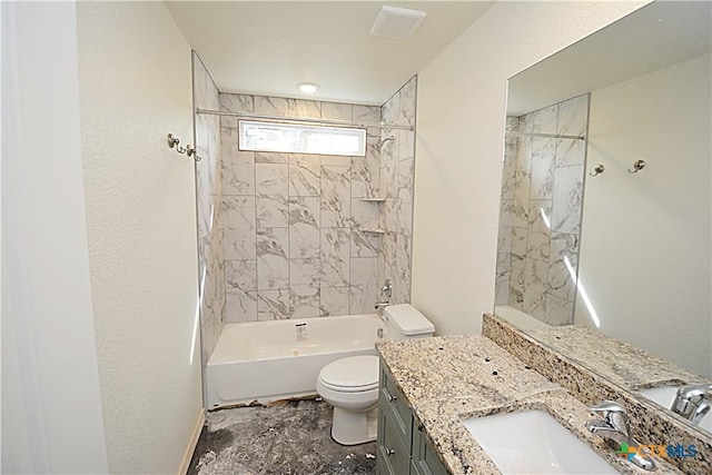 full bathroom with tiled shower / bath, vanity, and toilet