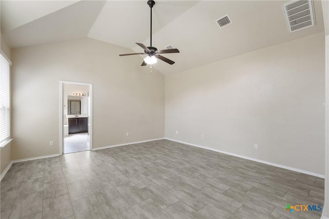 empty room with high vaulted ceiling, ceiling fan, visible vents, and baseboards