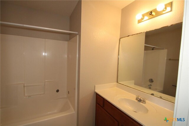 bathroom featuring vanity and shower / washtub combination