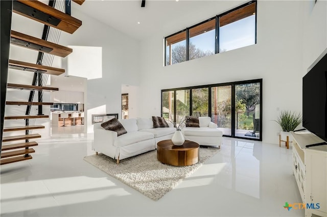 living room featuring french doors and a high ceiling