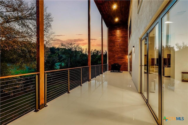 view of balcony at dusk