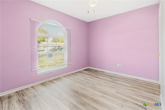 unfurnished room featuring light hardwood / wood-style flooring