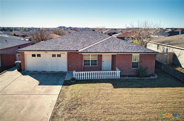 ranch-style house featuring a garage and a front yard