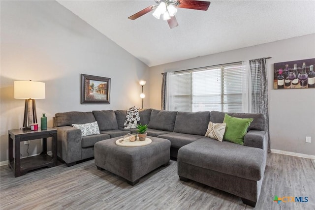 606 Brazos Dr, Temple, TX 76504 - living room featuring wood finished floors, ceiling fan, and lofted ceiling