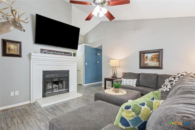 606 Brazos Dr, Temple, TX 76504 - living room featuring a ceiling fan, wood finished floors, vaulted ceiling, and a fireplace