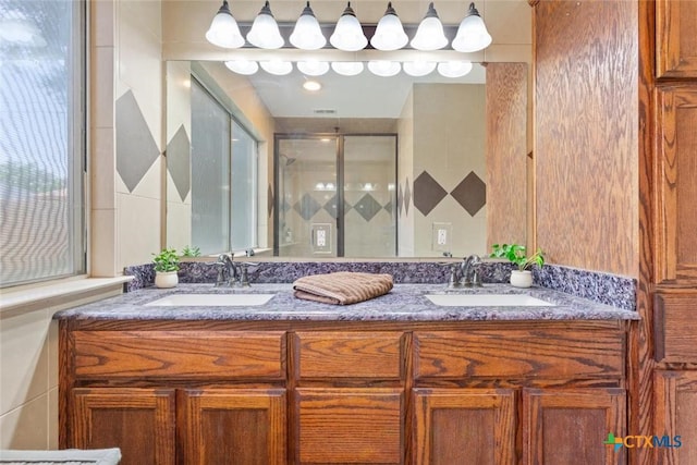 606 Brazos Dr, Temple, TX 76504 - bathroom featuring double vanity and a stall shower