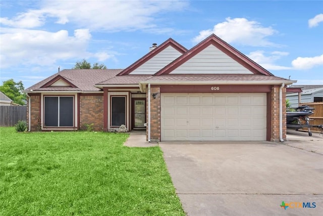 606 Brazos Dr, Temple, TX 76504 - view of front of property featuring brick siding, driveway, an attached garage, and roof with shingles