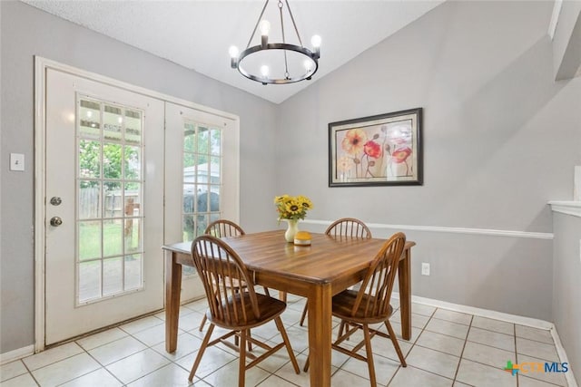 606 Brazos Dr, Temple, TX 76504 - dining space with a chandelier, lofted ceiling, and light tile patterned floors