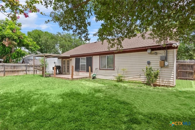606 Brazos Dr, Temple, TX 76504 - back of property featuring french doors, a fenced backyard, a patio, and a shingled roof