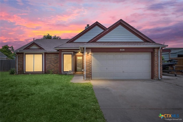 606 Brazos Dr, Temple, TX 76504 - view of front of home featuring driveway, brick siding, a garage, a shingled roof, and a chimney