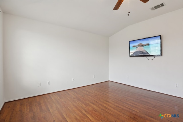 spare room featuring lofted ceiling, hardwood / wood-style floors, and ceiling fan