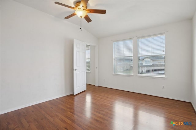 unfurnished room with vaulted ceiling, hardwood / wood-style floors, and ceiling fan