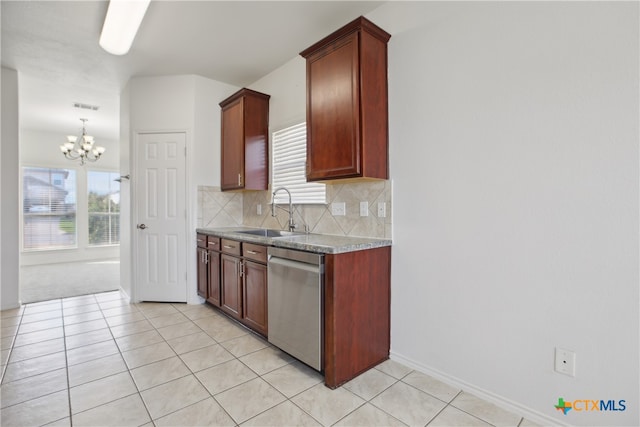 kitchen with dishwasher, sink, light tile patterned floors, and backsplash