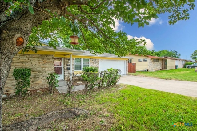1109 Meadow Dr, Killeen, TX 76549 - ranch-style house with concrete driveway, a garage, and stone siding