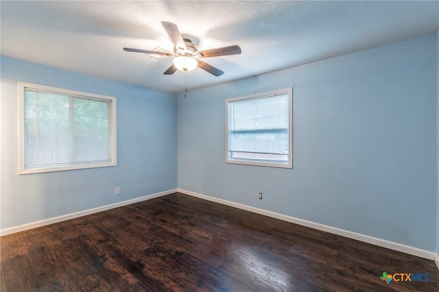 1109 Meadow Dr, Killeen, TX 76549 - spare room with plenty of natural light, dark wood finished floors, and a ceiling fan