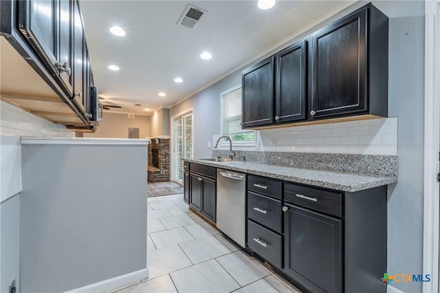 1109 Meadow Dr, Killeen, TX 76549 - kitchen with a sink, stainless steel dishwasher, tasteful backsplash, recessed lighting, and light tile patterned floors