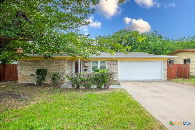 1109 Meadow Dr, Killeen, TX 76549 - view of front of house with driveway, an attached garage, and stone siding