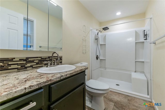 1109 Meadow Dr, Killeen, TX 76549 - bathroom featuring a shower stall, tasteful backsplash, vanity, and toilet