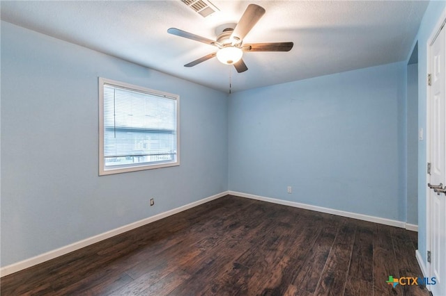 1109 Meadow Dr, Killeen, TX 76549 - empty room featuring ceiling fan, dark wood-style floors, and baseboards