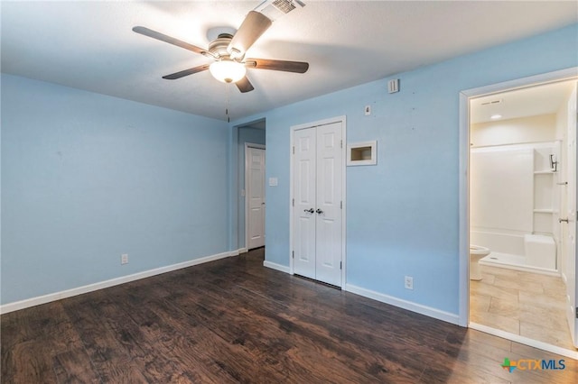 1109 Meadow Dr, Killeen, TX 76549 - unfurnished bedroom featuring wood finished floors, baseboards, connected bathroom, a closet, and ceiling fan