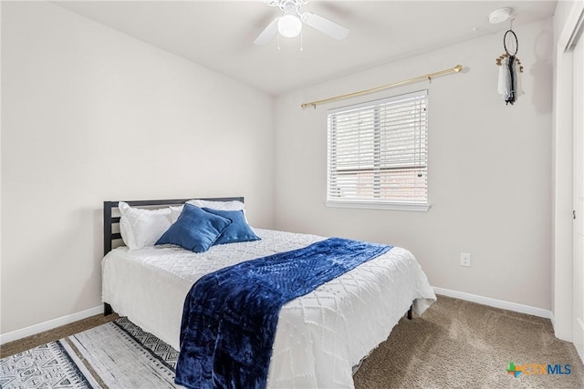 bedroom featuring baseboards, carpet floors, and ceiling fan