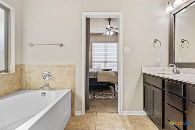 ensuite bathroom with vanity, a ceiling fan, tile patterned floors, a bath, and connected bathroom