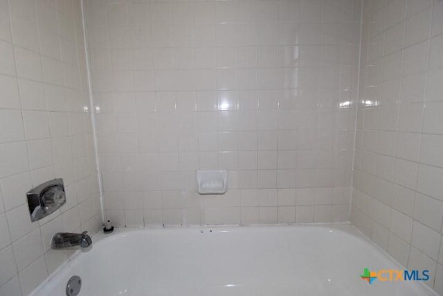 bathroom with a bathing tub