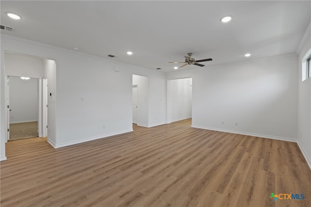 unfurnished room with light hardwood / wood-style flooring, ceiling fan, and ornamental molding