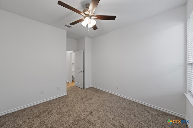 empty room with carpet floors and ceiling fan