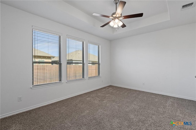 7310 Caladium Dr, Temple, TX 76502 - carpeted empty room featuring a raised ceiling, a ceiling fan, and baseboards
