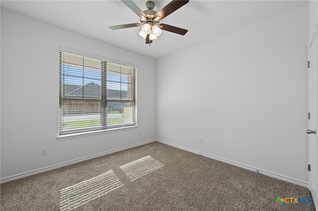 empty room featuring carpet and ceiling fan