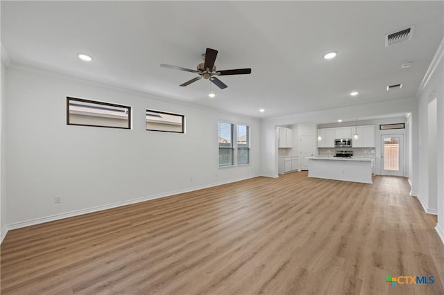 7310 Caladium Dr, Temple, TX 76502 - unfurnished living room featuring crown molding, recessed lighting, baseboards, light wood-type flooring, and ceiling fan