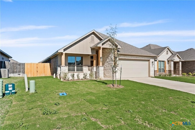 7310 Caladium Dr, Temple, TX 76502 - view of front facade featuring stone siding, an attached garage, concrete driveway, and board and batten siding