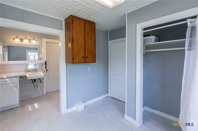 807 E 12th Ave, Belton, TX 76513 - kitchen featuring brown cabinetry and light countertops