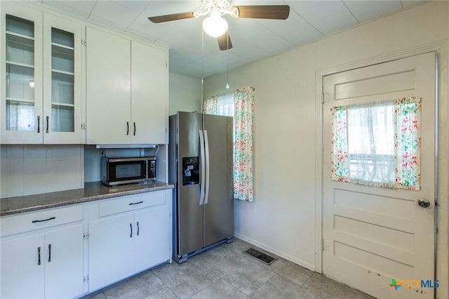 807 E 12th Ave, Belton, TX 76513 - kitchen featuring appliances with stainless steel finishes, ceiling fan, healthy amount of natural light, and white cabinets