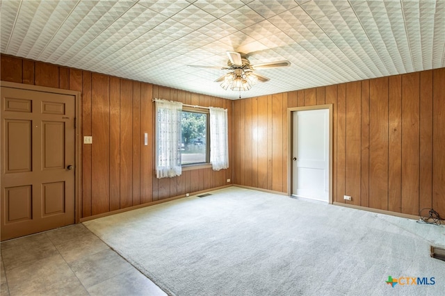 807 E 12th Ave, Belton, TX 76513 - foyer entrance featuring ceiling fan and wood walls