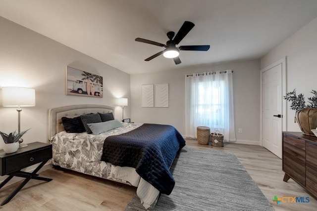 bedroom featuring ceiling fan and light hardwood / wood-style floors