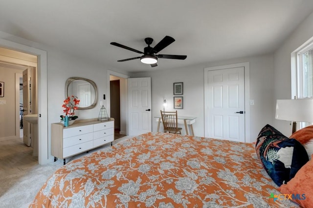 carpeted bedroom with ceiling fan