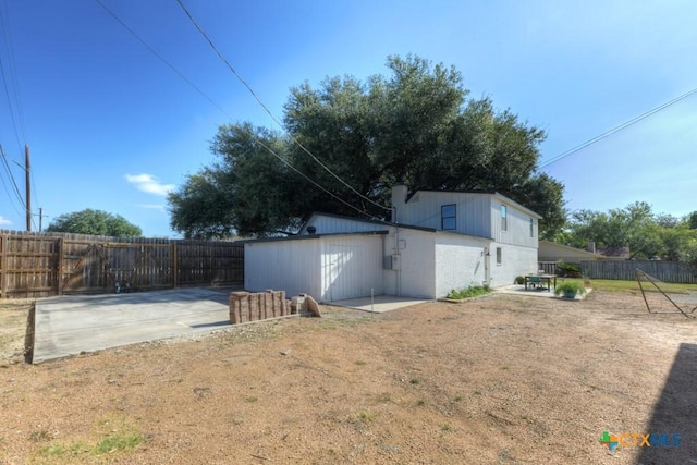 view of yard with an outdoor structure and a patio