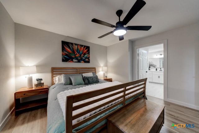 bedroom with connected bathroom, ceiling fan, and light hardwood / wood-style floors