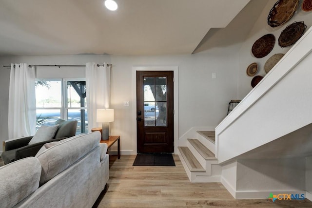 entryway with light hardwood / wood-style flooring