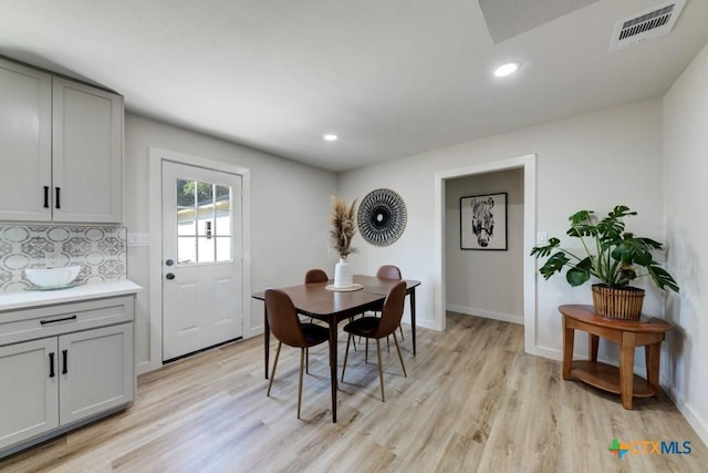 dining area with light hardwood / wood-style flooring