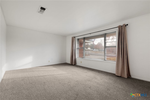 unfurnished room with carpet flooring