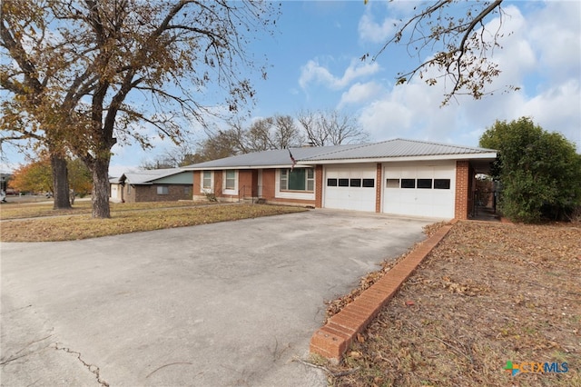 ranch-style home featuring a garage