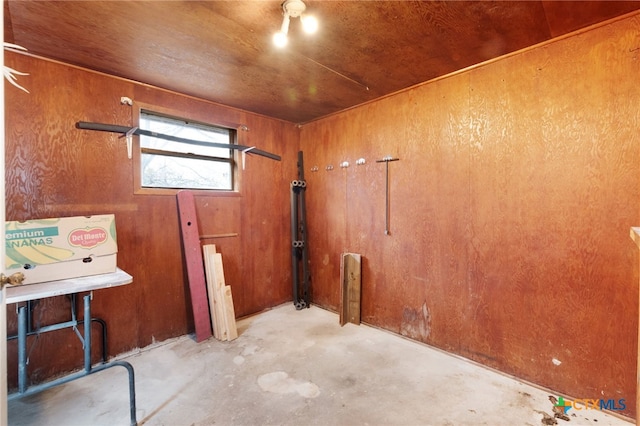 interior space with wood walls and wooden ceiling