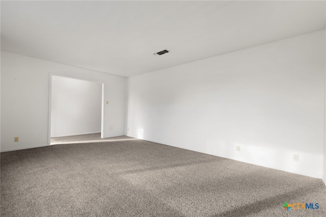 empty room featuring carpet floors