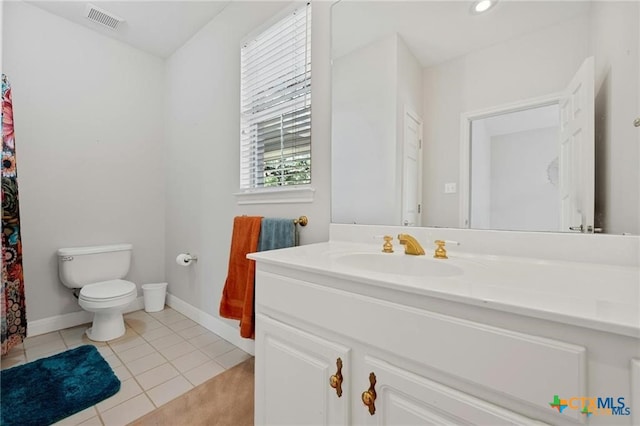 1100 Appalachian Trl, San Marcos, TX 78666 - full bathroom with tile patterned floors, vanity, baseboards, toilet, and visible vents