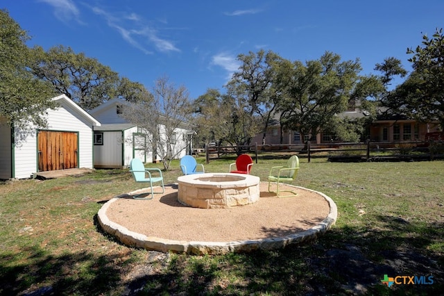 1100 Appalachian Trl, San Marcos, TX 78666 - view of yard with a storage shed, an outbuilding, and an outdoor fire pit