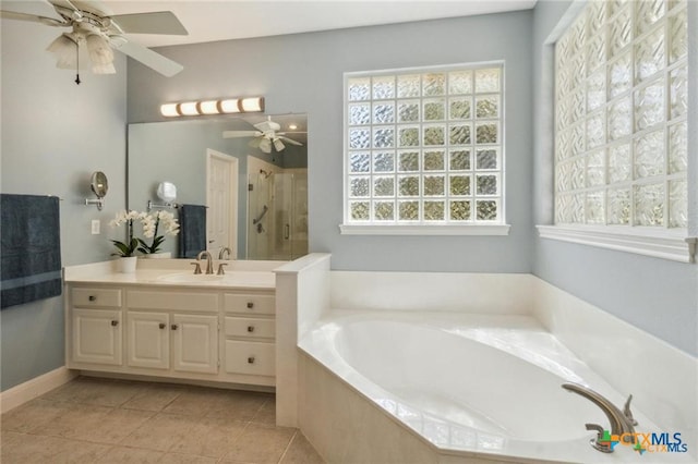 1100 Appalachian Trl, San Marcos, TX 78666 - bathroom with a bath, tile patterned floors, a shower stall, and ceiling fan