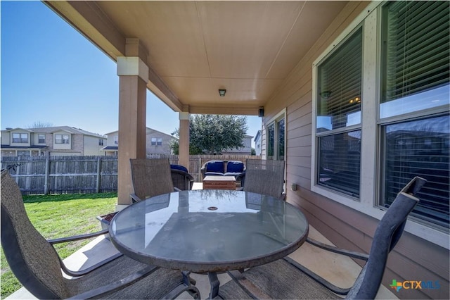 view of patio / terrace with outdoor dining area and a fenced backyard